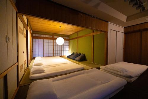 a row of beds in a room at mion - Vacation STAY 52998v in Hota
