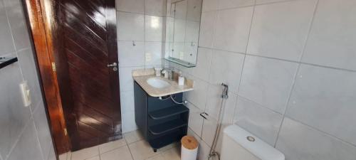 a bathroom with a sink and a toilet at Appartamento em ponta negra in Natal