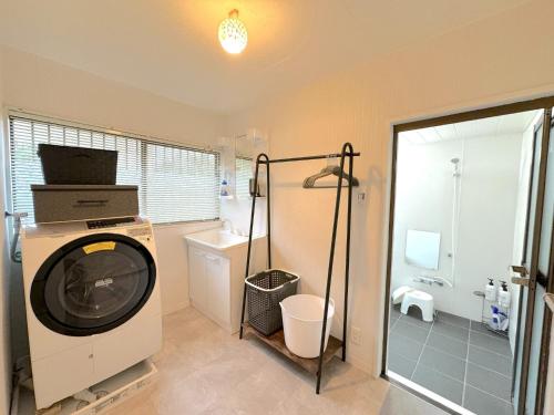 a bathroom with a washing machine and a shower at Ashigarashimogun - House - Vacation STAY 17328 in Miyakami