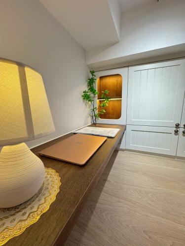 a room with a desk with a laptop on it at Ly Lakeside House Tay Ho Ha Noi in Hanoi