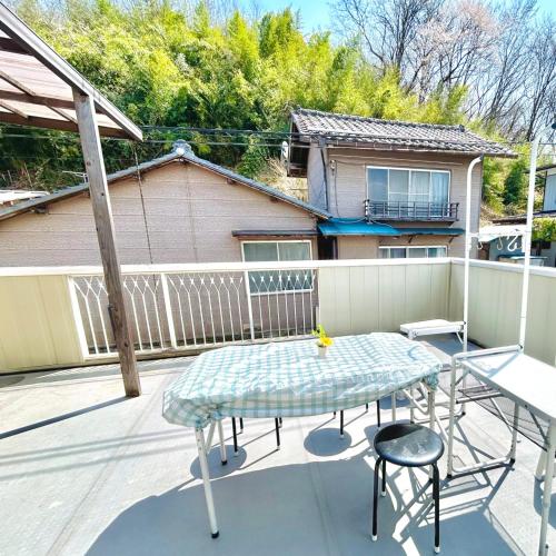 a patio with a table and chairs and a fence at Makeit 1to3 - Vacation STAY 17356 in Chichibu