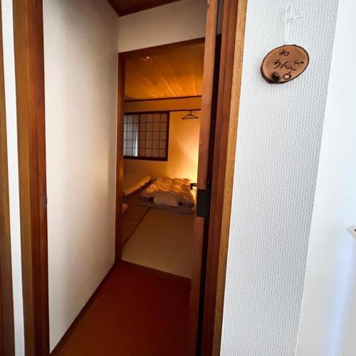 an open door to a room with a bathroom at Makeit 1to3 - Vacation STAY 17356 in Chichibu