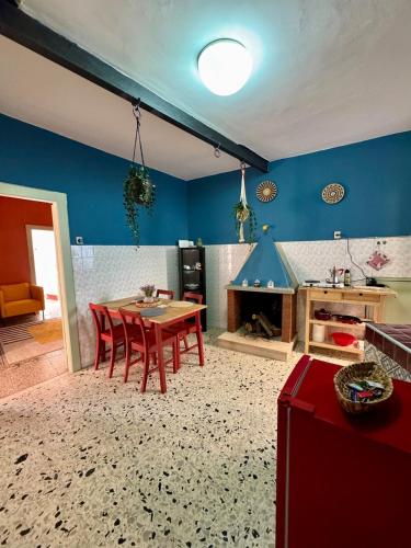a kitchen with a table and chairs in a room at Historic & Charming Home in Bassiano in Bassiano