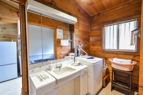 a bathroom with a sink and a washing machine at 410 COZY INN - Rental villa with natural hot sprin - Vacation STAY 54148v in To-katta