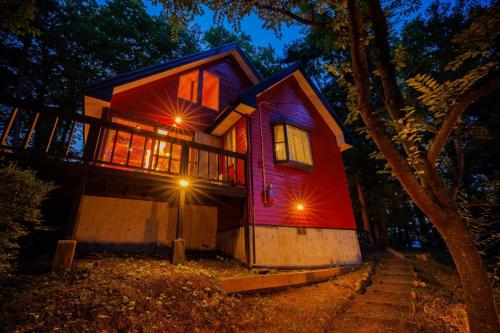 a house is lit up at night at Gubo Satoyama SUITE Miyagi Zao - Vacation STAY 54123v in To-katta