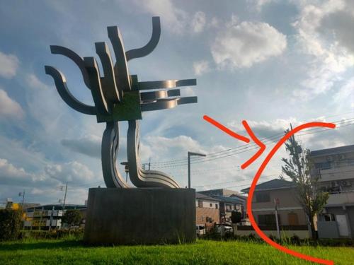 a large metal sculpture in the middle of a field at MaMe Inn, - Vacation STAY 58206v in Saitama