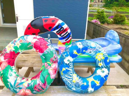 a pair of inflatableoops sitting on top of a bench at Guest House Aji Nakaniwa - Vacation STAY 17513 in Takamatsu