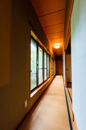 an empty hallway with windows in a building at Ikkokukan - Vacation STAY 54272v in To-katta