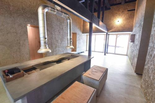 a large tub in a room with a bench and pipes at glaminka SAYO - Handi - Vacation STAY 85065v in Sayo