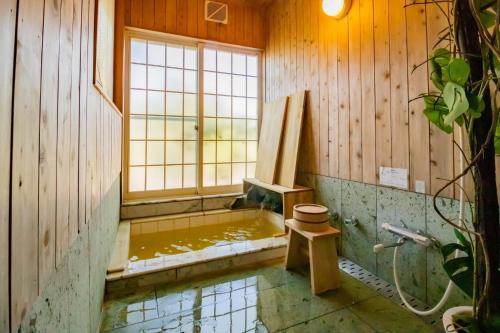 a bathroom with a tub with a window at Kattagun - House - Vacation STAY 17460 in To-katta