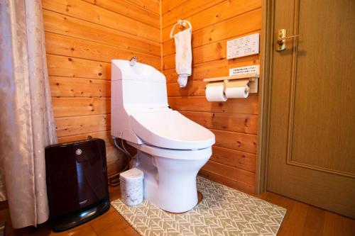 a bathroom with a toilet in a wooden wall at Shibatagun - House - Vacation STAY 17461 in Aone