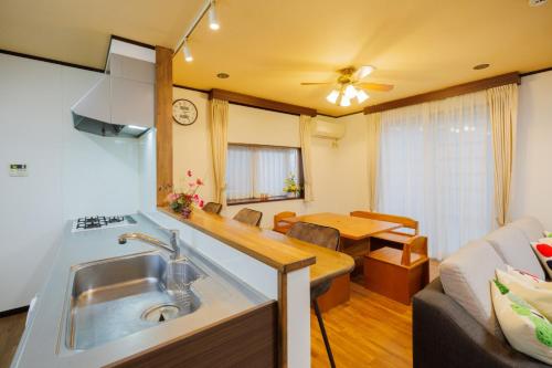 a kitchen and living room with a sink and a couch at Shibatagun - House - Vacation STAY 17462 in Murata