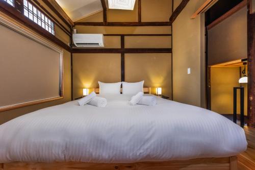 Ένα ή περισσότερα κρεβάτια σε δωμάτιο στο Kyoto City - House - Vacation STAY 17378