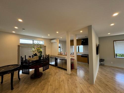 a dining room and kitchen with a table and chairs at Setouchi no Yado - Vacation STAY 17689 in Matsuyama