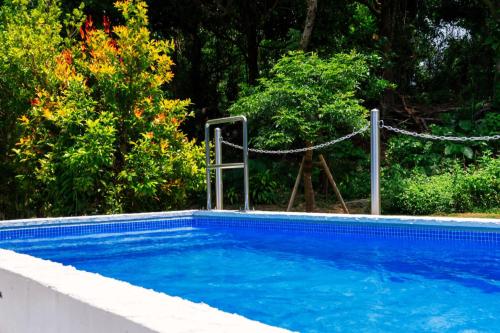 a blue swimming pool with a rope around it at RYUKYU BREEZE No,1, No,2, No,3, No,4 - Vacation STAY 91466v in Nago