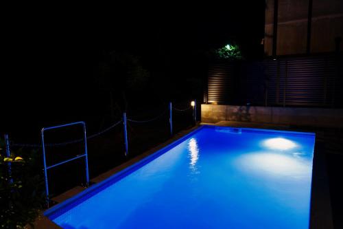 a swimming pool at night with blue illumination at RYUKYU BREEZE No,1, No,2, No,3, No,4 - Vacation STAY 91504v in Nago