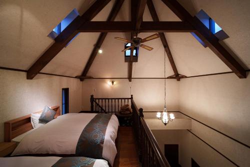 a bedroom with two beds and a ceiling fan at Suida no Yado - Vacation STAY 04892v in Yufuin