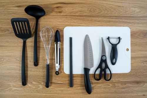 a group of kitchen utensils sitting on a table at Flex cella satozuka - Vacation STAY 17763 in Sapporo