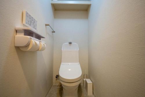 a small bathroom with a white toilet in a room at Flex cella satozuka - Vacation STAY 17763 in Sapporo