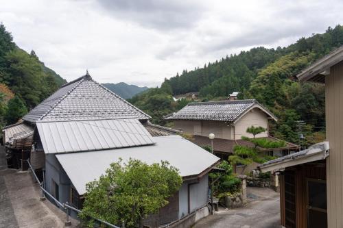 a group of houses with mountains in the background at Shirataki no yado - Vacation STAY 29763v in Higashimiyoshi