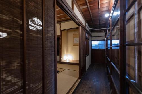 a hallway in a house with wooden walls at R-house 5th - Vacation STAY 17834 in Numazu