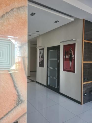 a room with a door and a painting on the wall at Business Apart Arkadia in Odesa