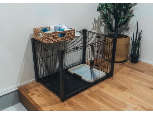 a black bird cage sitting on a wooden floor at Viila NO°00 - Vacation STAY 34231v in Awaji