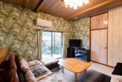 a living room with a couch and a table at Long - Vacation STAY 56447v in Manazuru