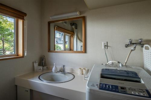 a bathroom with a sink and a sewing machine at Private Inn Kazu - Vacation STAY 56401v in Abuta