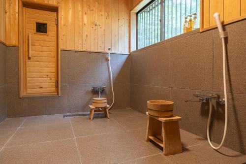 a bathroom with a shower and a toilet in a room at Nasu Premium House - Vacation STAY 17949 in Nasu-yumoto