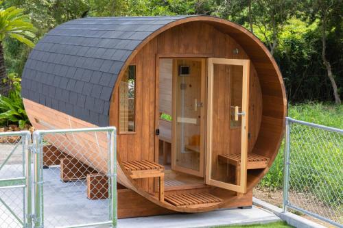 a wooden hobbit house with a black roof at UMICHIKA 6886 - Vacation STAY 64201v in Ichinomiya