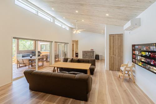 a living room with a couch and a table at UMICHIKA 6886 - Vacation STAY 64201v in Ichinomiya