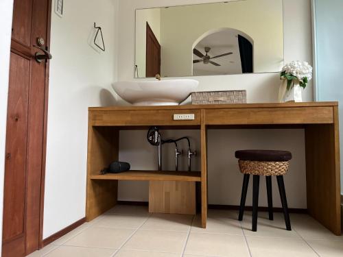a bathroom with a vanity with a sink and a stool at Onomichi Villa Ayah - Vacation STAY 53453v in Onomichi