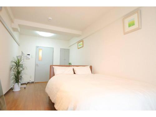 Postel nebo postele na pokoji v ubytování City Avenue Asahimachi - Vacation STAY 18048