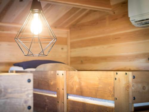 a light hanging over a table in a room at dejavu - Vacation STAY 56317v in Manazuru