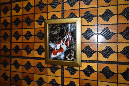a picture of a clown in a frame on a wall at ShiripaYoichi Villa - Vacation STAY 62970v in Kurokawamachi