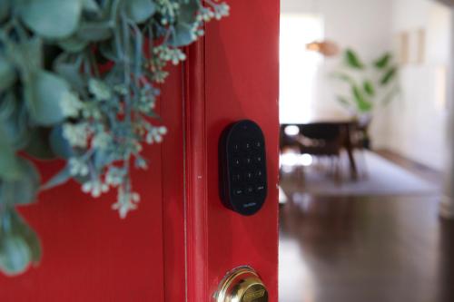 a remote control on the side of a red door at Boston Manor in Indianapolis