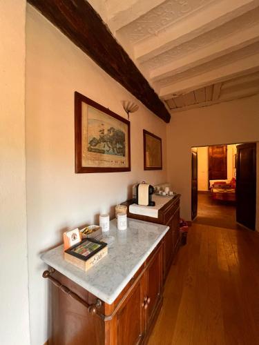 a room with a counter top and a room with a room at Casa Rossa - Sweet Harmony in Castellinaldo