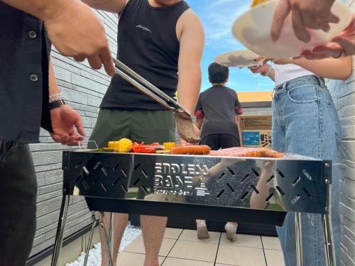 a group of people standing around a hot dog grill at 8Room - Vacation STAY 70870v in Yachimata