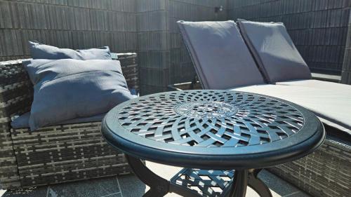 a blue table and a chair on a patio at 8Room - Vacation STAY 70870v in Yachimata