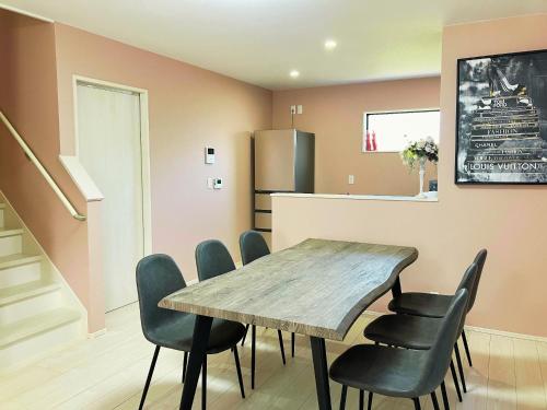 a dining room with a wooden table and chairs at Building A - Vacation STAY 72692v in Kikuchi