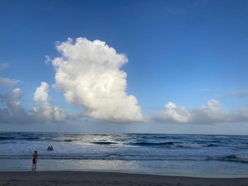 a person standing on a beach with the ocean at Hitachiota Studio - Vacation STAY 18131 in Hitachi Ota