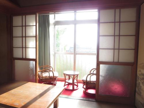 a room with a table and chairs and a window at Hitachiota Studio - Vacation STAY 18131 in Hitachi Ota