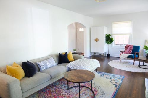 a living room with a couch and a table at Boston Manor in Indianapolis