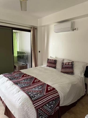 Ένα ή περισσότερα κρεβάτια σε δωμάτιο στο CC Beach villa in wailoaloa