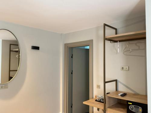 a room with a mirror and a door at OTTO X Hotel in Kavaklıdere