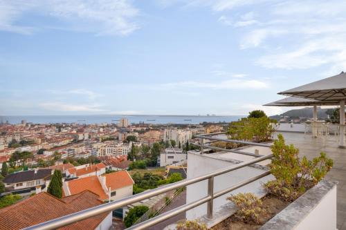 a view of the city from the balcony of a house at B&B HOTEL Sado Setúbal in Setúbal