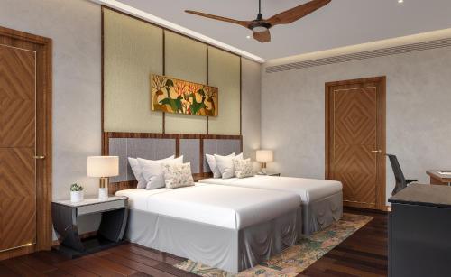 a bedroom with two beds and a ceiling at Taj Damdama Lake Resort & Spa, Gurugram in Gurgaon