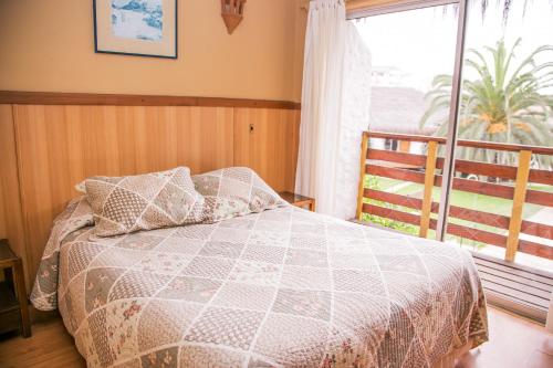 Ένα ή περισσότερα κρεβάτια σε δωμάτιο στο Cabañas Las Añañucas I