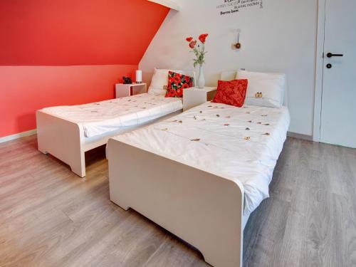 two beds sitting next to each other in a room at Holiday Home in Koekelare with Scenic Views in Koekelare